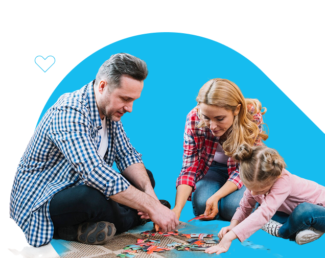 guardians playing puzzle with young girl