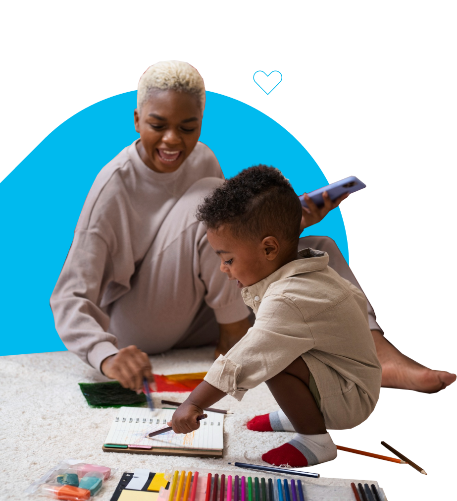 young boy and guardian helping with drawing